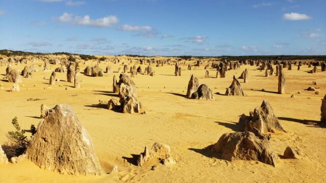 Rock formations rising from sand in Pinnacles Desert