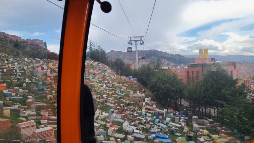 View of a colorful cemetery from the Orange Line cable car in La Paz