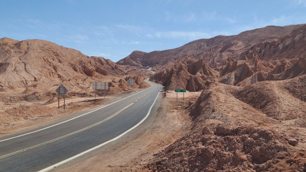 Road to San Pedro de Atacama, an end point of the three day Uyuni tour, through a Mars-like landscape of red rock formations