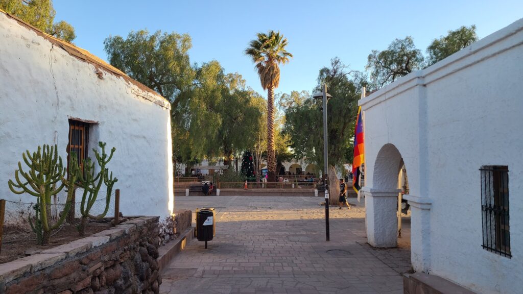 The town of San Pedro de Atacama with white buildings near the main square