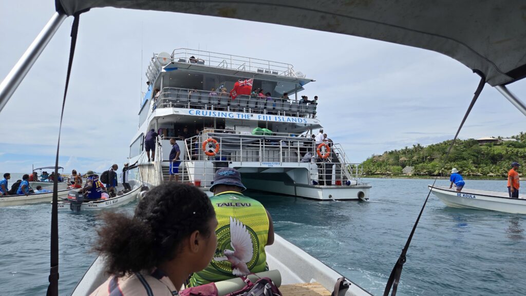 Motorboats coming up to the Yasawa Flyer